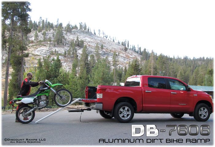 Loading a dirt bike up the aluminum motocross ramp