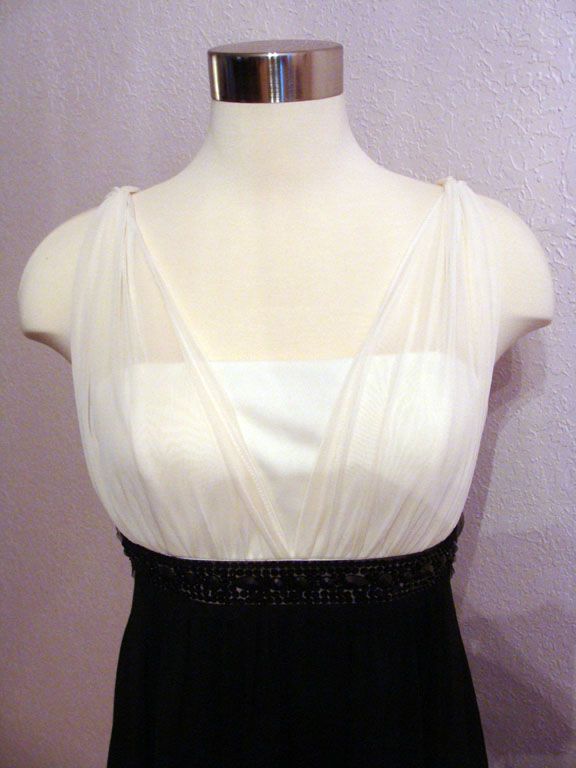   dress with a drape front. Fully lined with back zipper .Great buy