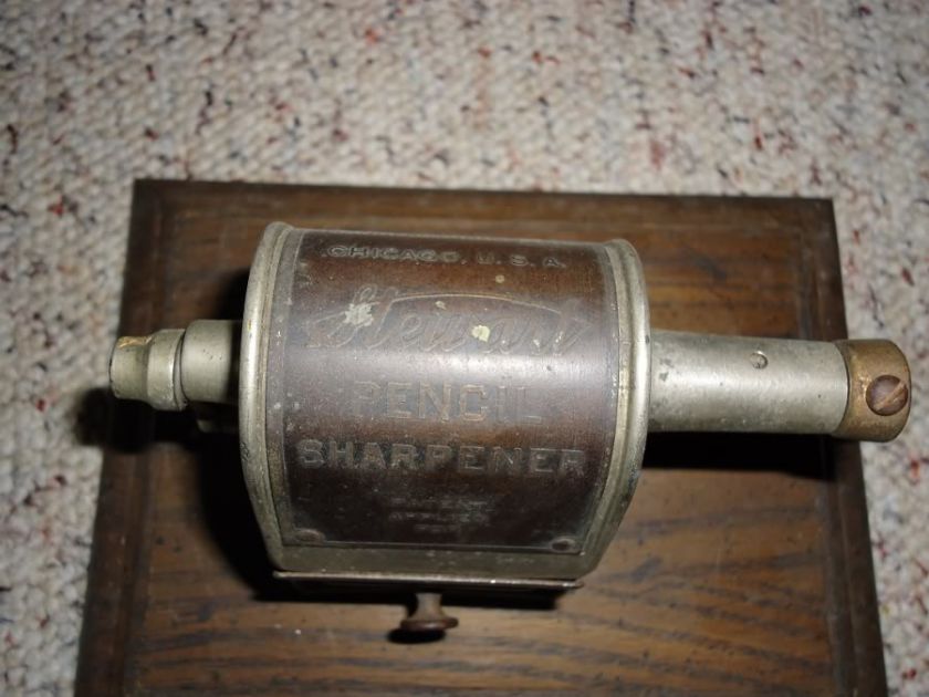 Vintage Stewart Pencil Sharpener 1920s on wood display stand  