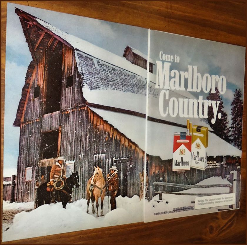 1976 MARLBORO MAN CIGARETTES Photo AD Cowboys Outside Barn in Snow 